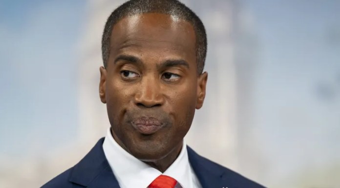 John James Plays The Race Card